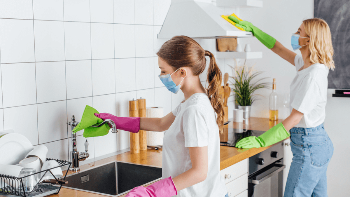 Two women cleaning the kitchen MSN