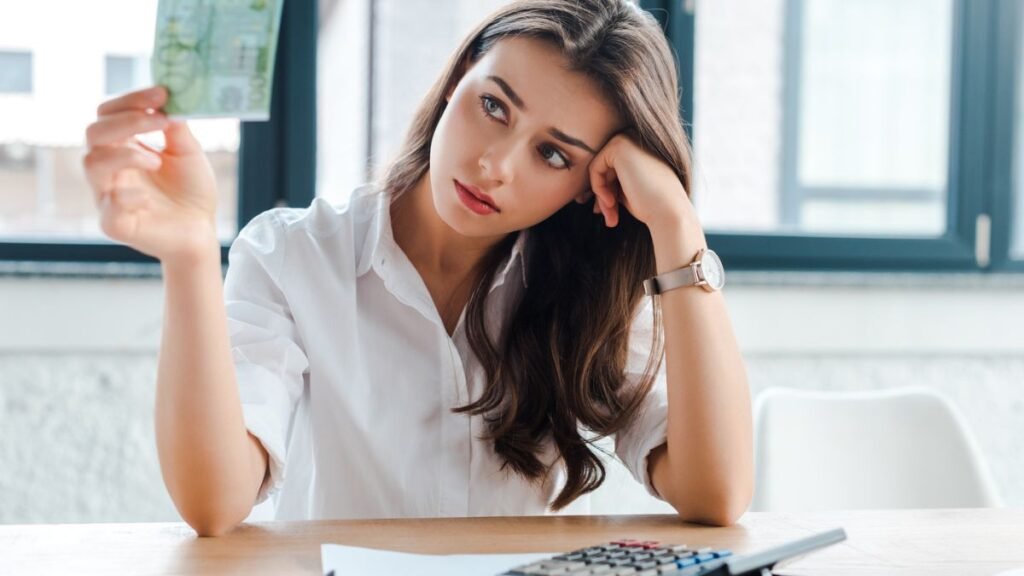 Woman Looking At Money Worried MSN