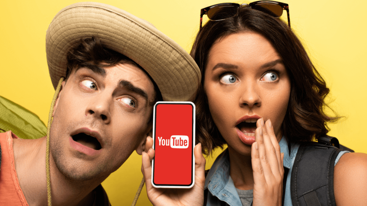 Couple holding a phone with the YouTube logo MSN