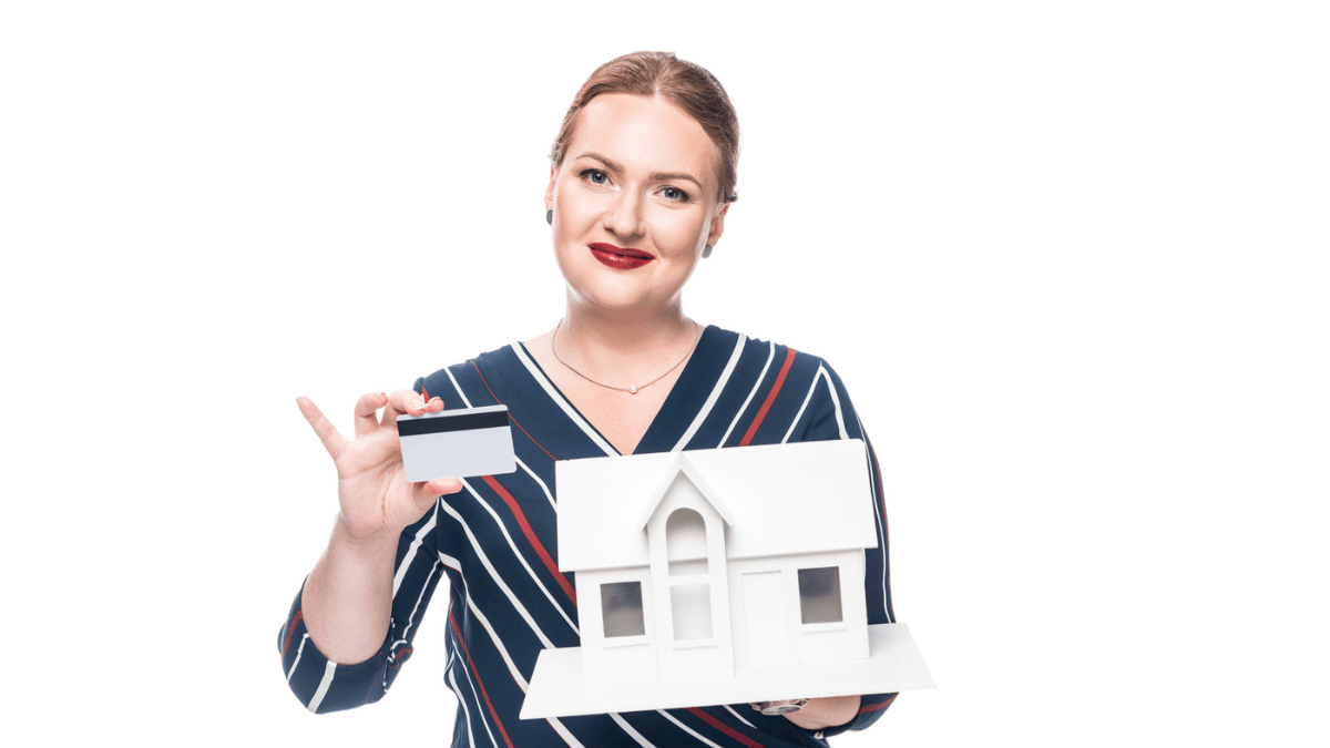 Happy female estate agent showing maquette of new house