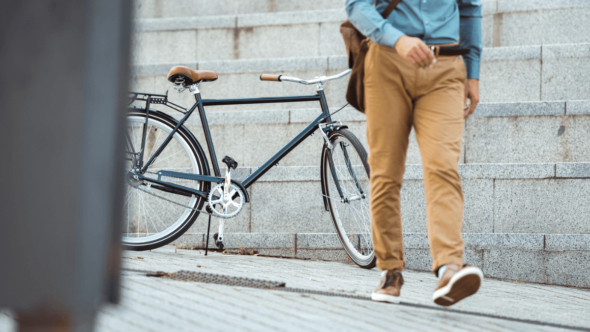 Man Walking With Bike Steps Background