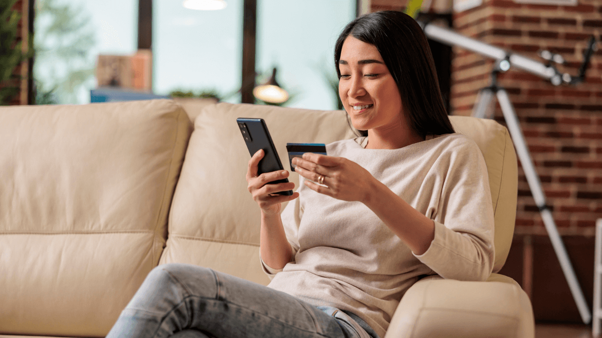 Woman making online purchases with a credit card